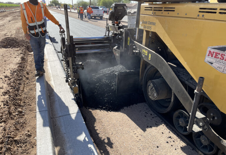 Asphalt being spread during Lower Buckeye Road project